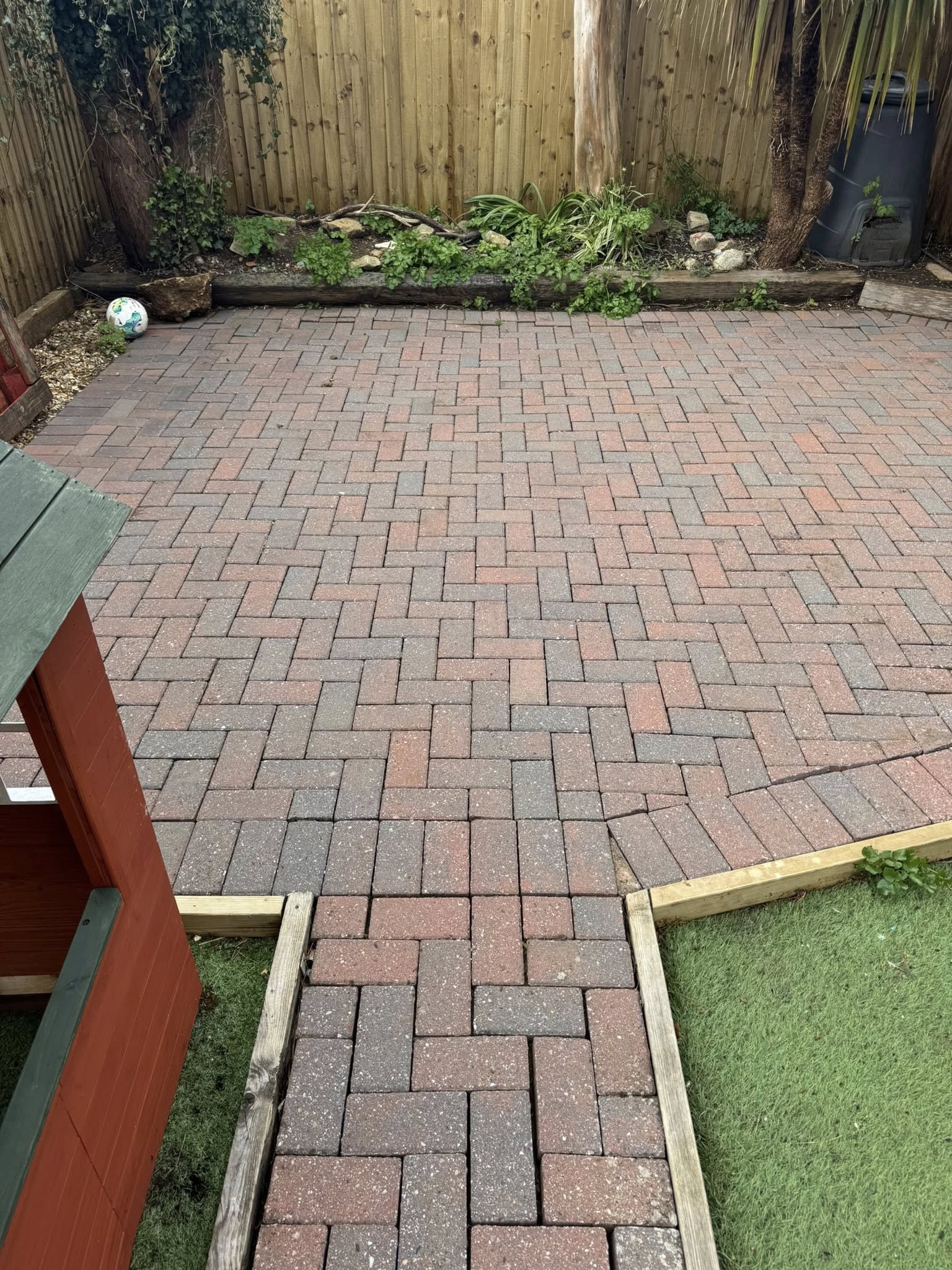 Block paved patio in a garden after pressure washing in Weymouth