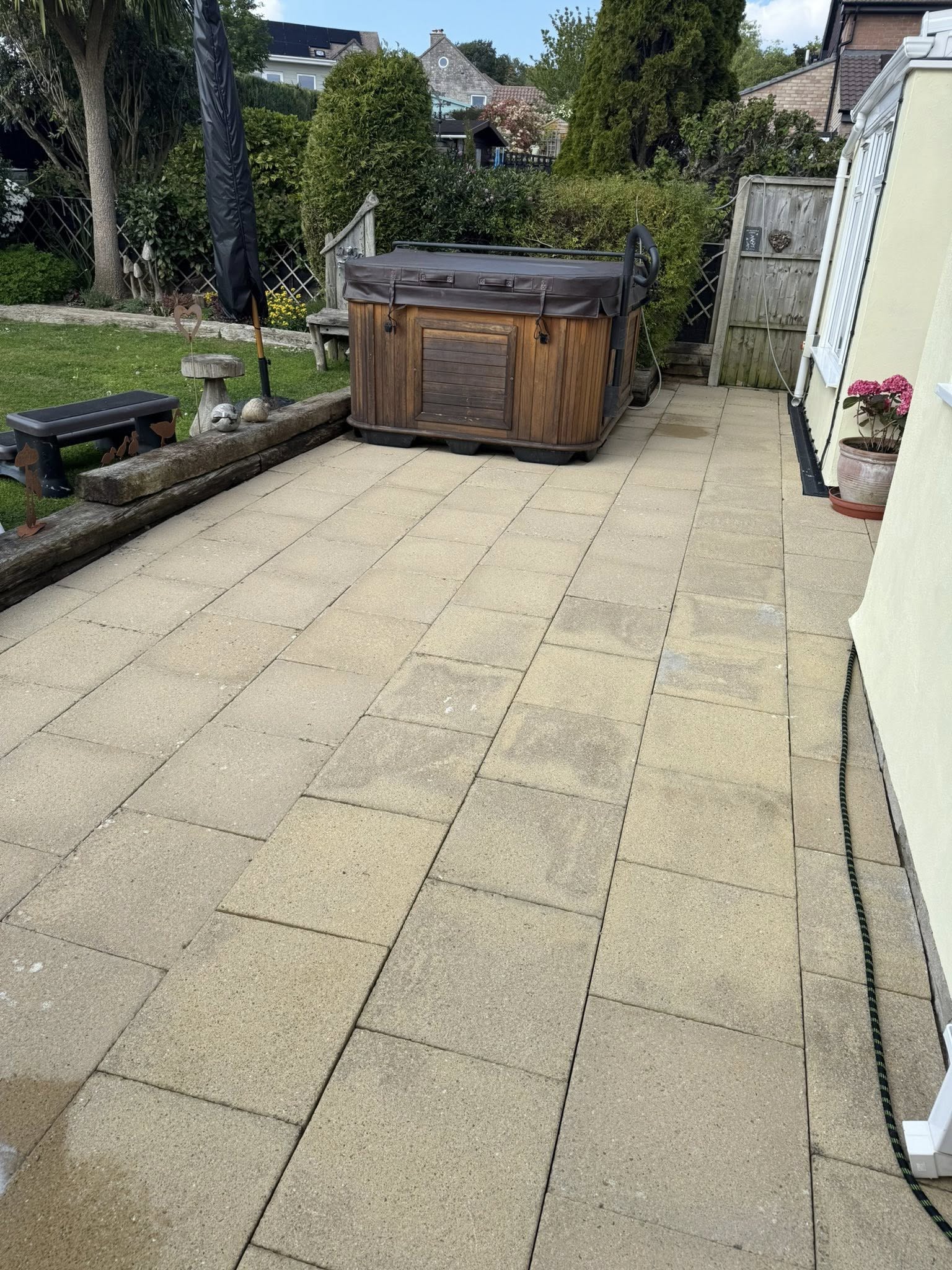Paved patio area of a house after pressure washing in Weymouth