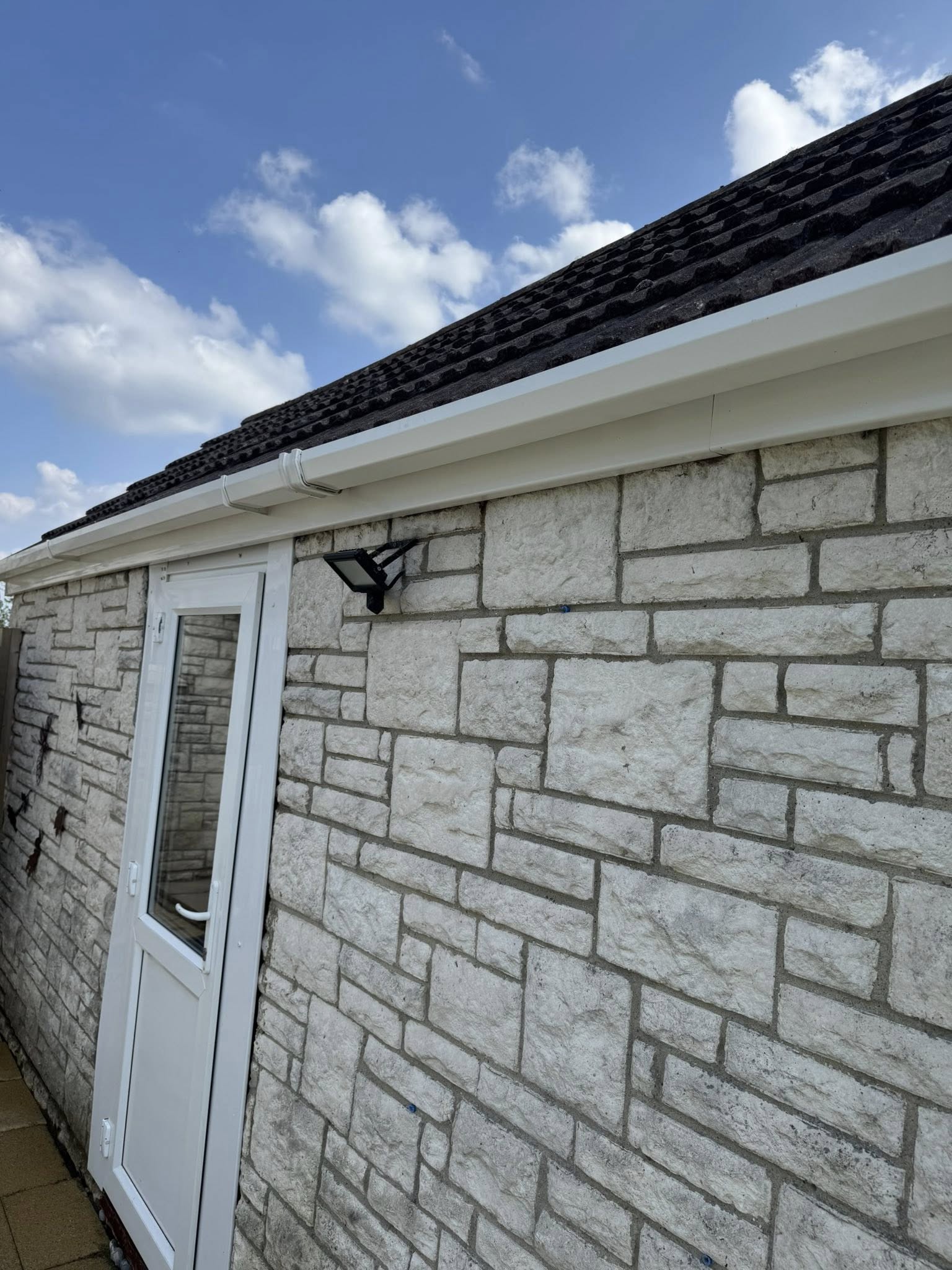 Gutters on a garage in Weymouth after being pressure washed