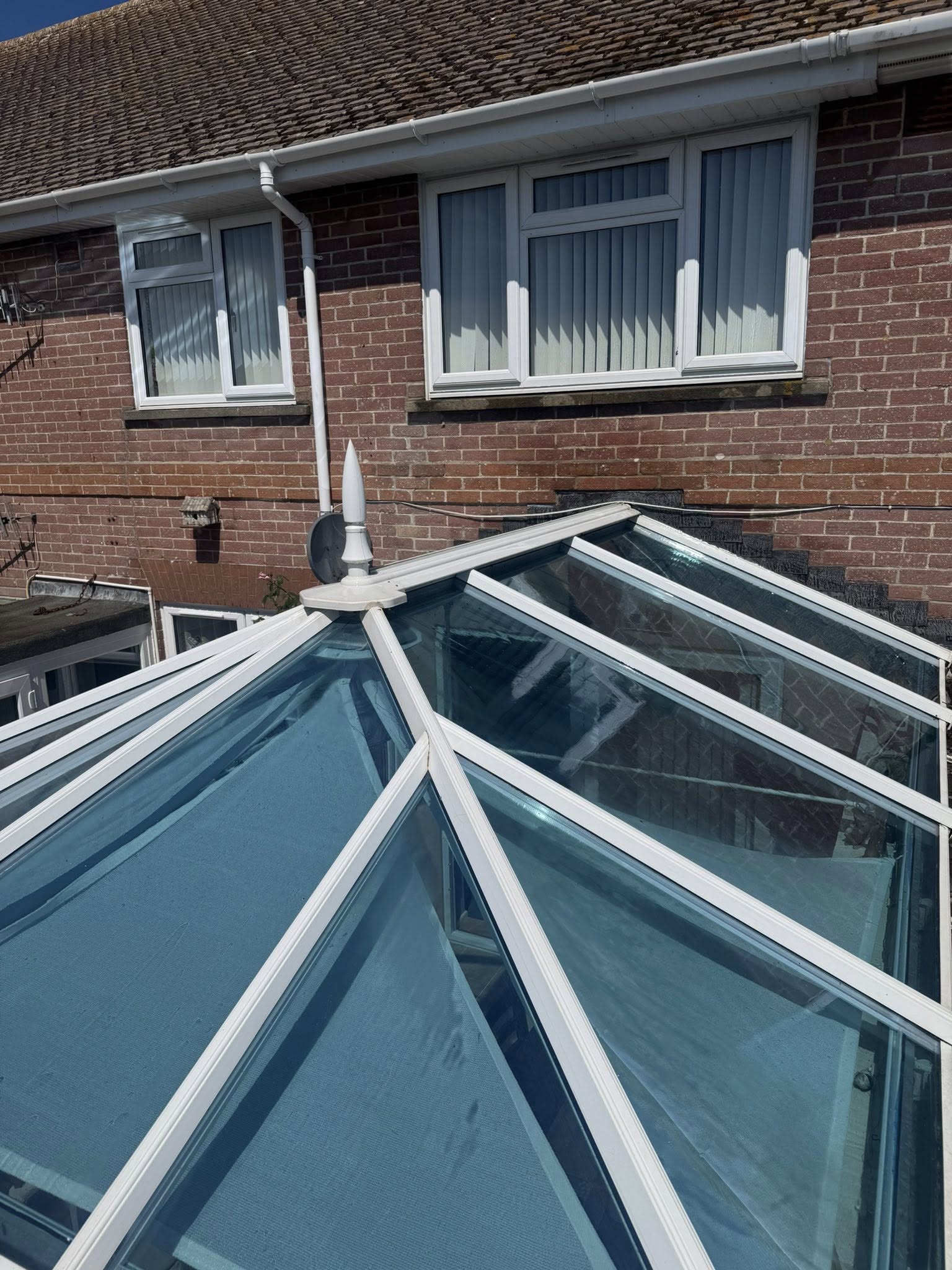 Pressure washed glass conservatory roof in Weymouth